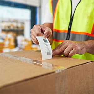 RFID Tag being placed on a package